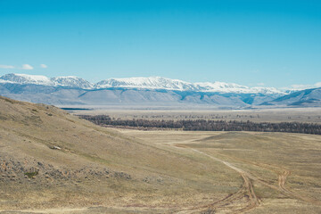 Snow-capped mountains. Mountain Altai. Kurai steppe