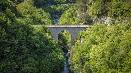 Fototapeta premium Lavelle bridge between Cerreto Sannita and Cusano Mutri in Benevento, Italy. This place is famous in Italy due to the erosion of the rocks by the river. Perfect place for trekking and nature lovers.