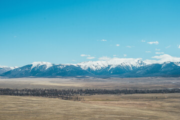 Fototapeta na wymiar Snow-capped mountains. Mountain Altai. Kurai steppe
