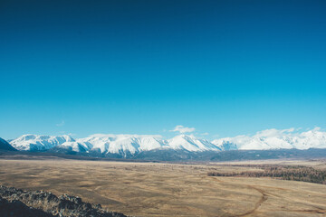 Snow-capped mountains. Mountain Altai. Kurai steppe