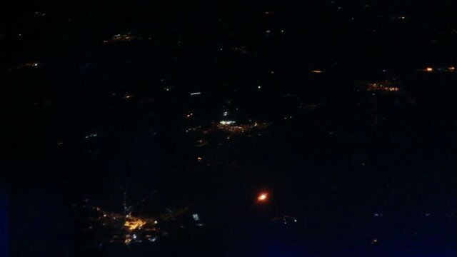 Flight over night Warsaw. The view from the porthole. City Lights