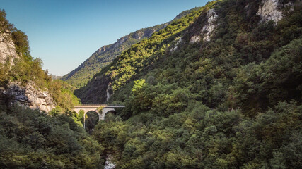 Fototapeta na wymiar Lavelle bridge between Cerreto Sannita and Cusano Mutri in Benevento, Italy. This place is famous in Italy due to the erosion of the rocks by the river. Perfect place for trekking and nature lovers.