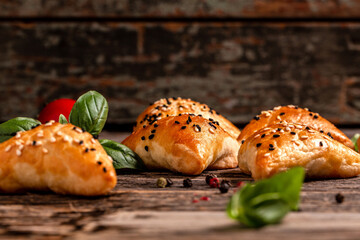 Wooden board with delicious meat samosas, closeup. banner menu recipe place for text