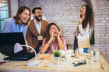 Startup business team on meeting in modern bright office interior brainstorming, working on computer