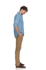 Fototapeta premium happy casual model waiting in line and looking down