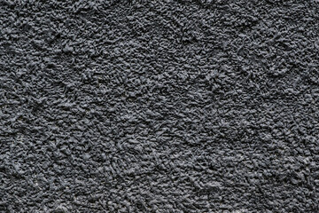 Black gloomy surface. Black stucco.