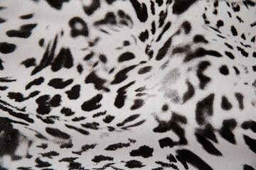 Black and white abstract camouflage. The concealment pattern on a fabric. Concept of winter masking.