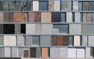 Large assortment of marble and granite samples on a display of a building material shop