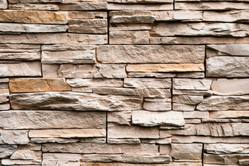 Stone lined with granite wall, sandstone, stone background wall. Facing Stone, rock texture, backdrop
