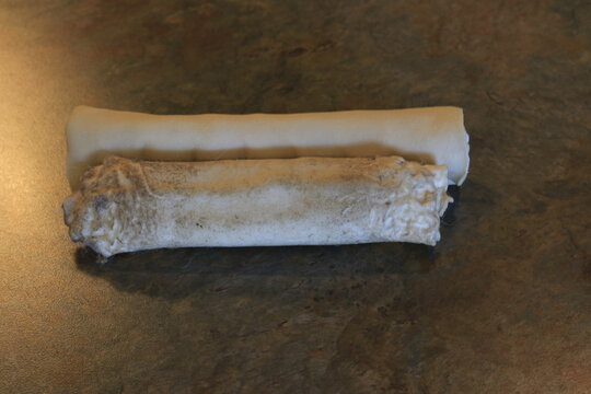 Rawhide Is Considered A Controversial Dog Chew Due To The Risk Of Dogs Choking. Photo Showing Partly Chewed Rawhide