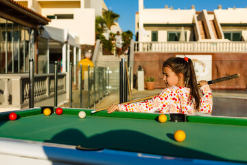 pool table near the sea, family plays billiards