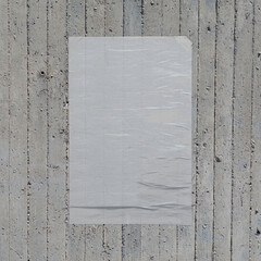 white crumpled poster on concrete wall background