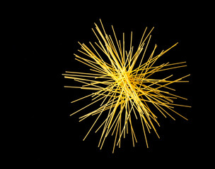 Fototapeta premium Arrangement of italian Spaghetti on black background, free copy space