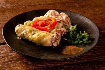 Arabic food. Appetizing cabbage rolls on wood background