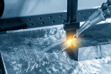 The EDM machine operation with the lighting effect. The machining mold and die by  EDM graphite...