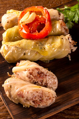 Arabic food. Appetizing cabbage rolls on wood background
