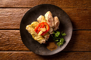 Arabic food. Appetizing cabbage rolls on wood background