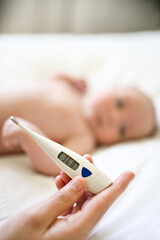 Temperature of healthy baby lay on the bedroom