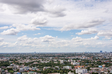 Obraz premium The Bangkok cityscape from skyscraper view with clouds and blue sky.
