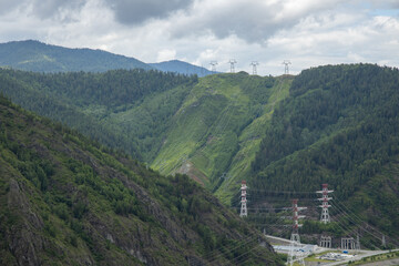 high voltage line in the mountains summer