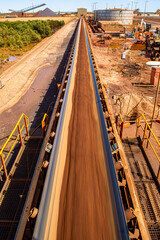 Naklejka premium Conveyor belt carrying iron ore
