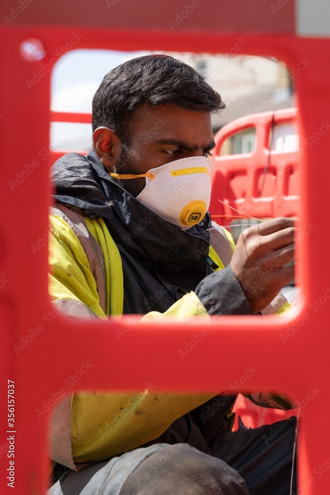 Canvas Prints Male worker wearing a medical face mask - Covid-19 concept