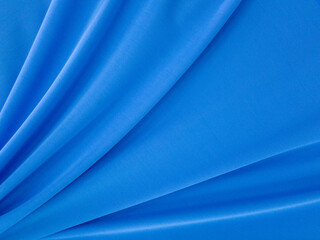 Texture background template. Silk color light blue background is a shiny light blue wave