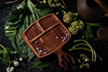 Wooden board with clear space .Fresh vegetables and ingredients for cooking around vintage cutting board on rustic background, top view, 