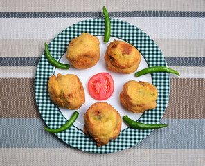 Mashed potato balls coated with chickpea flour and fried