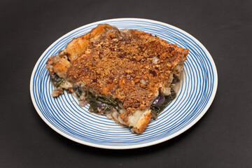 A Piece of Egyptian Spinach Pie with a Dukkah crust topping