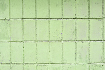 Naklejka premium Beautiful vintage green background with old green paint with a rough surface, streaks and uneven texture of green paint on an old rough surface