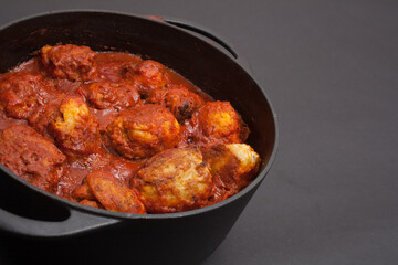 Libyan Mafrum, stuffed potatoes with minced beef and cooked in a tomato sauce