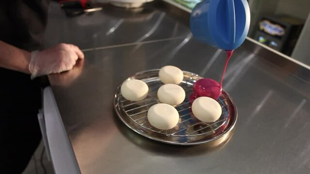 Glazing a cake. Glossing. Cake making process. 