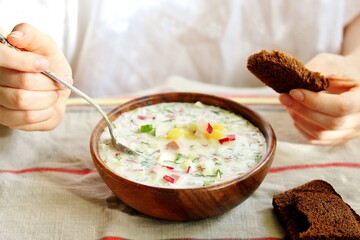 okroshka - Russian cold soup and hands. Space for text. copy space