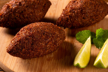Kibbeh - Middle Eastern minced meat and bulghur wheat fried snack. Also popular party dish in Brazil (kibe).