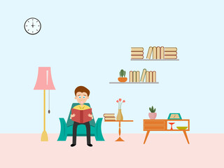 A man sitting reading a book in the living room with blue background