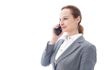 スマートフォンを使うスーツを着たビジネスウーマン