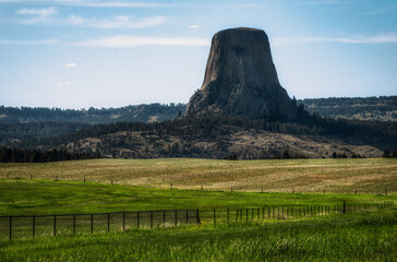 The dramatic shape of Devils Tower rises above the hills of eastern Wyoming, USA.                              