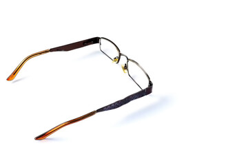 glasses with metallic dark brown frames on a white background
