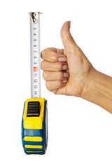 Female hand depicts the sign OK. Yardstick. Measuring tape. Isolate on a white background. Construction concept