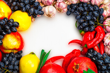 Frame made of fruits and vegetables with white space in center for placing text