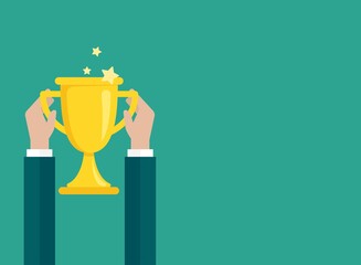 Hands with gold trophy, winning cup isolated on blue background.