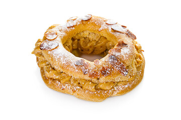 Tasty Paris Brest with almond stuffed with caramel cream isolated on white background