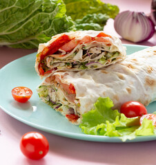 Shawarma with chicken and vegetables on a plate