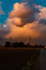 Beautiful sunset with dramatic clouds near Tabertshausen, Bavaria, Germany