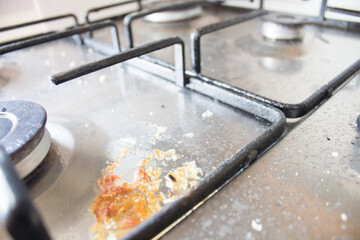  dirty stove close up. house cleaning concept. metal stove with contaminants from cooking. Dirty gas burner