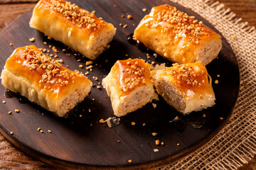 Turkish Dessert Kadayif on wood background.