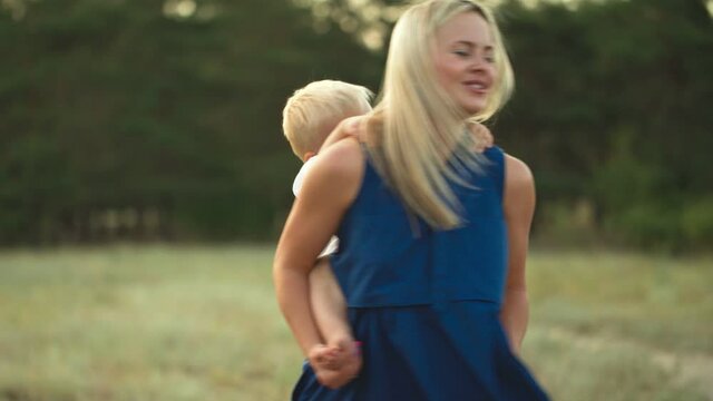 Boy piggybacking on his mothers back
