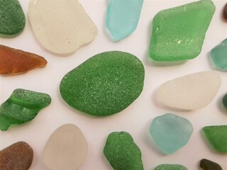 Sea glass close up photo. Small pieces of sea glass-shards, polished by the sea waves.