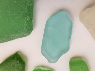 Sea glass close up photo. Small pieces of sea glass-shards, polished by the sea waves.